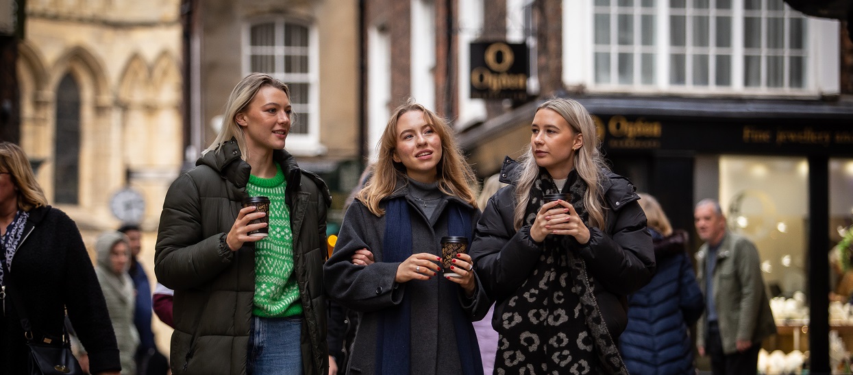 Three women walking in York